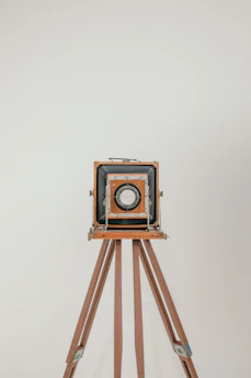 An old-fashioned 4x5 large format camera set up in a quiet studio.