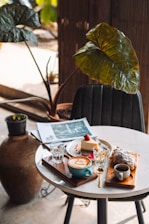 A cozy café table with a cup of espresso, a slice of homemade cake, and a glass of fresh juice.