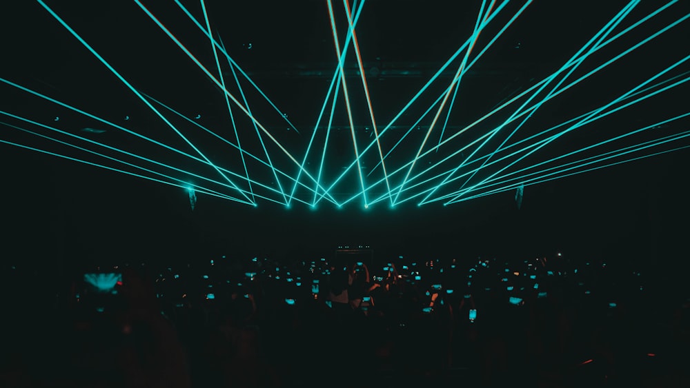 a large group of people in a dark room