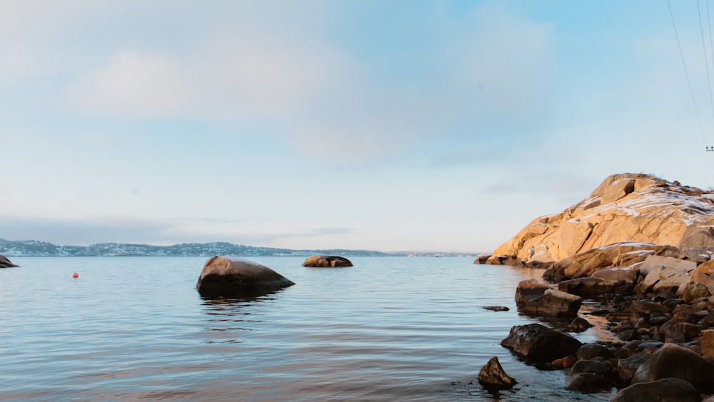 a large body of water surrounded by rocks