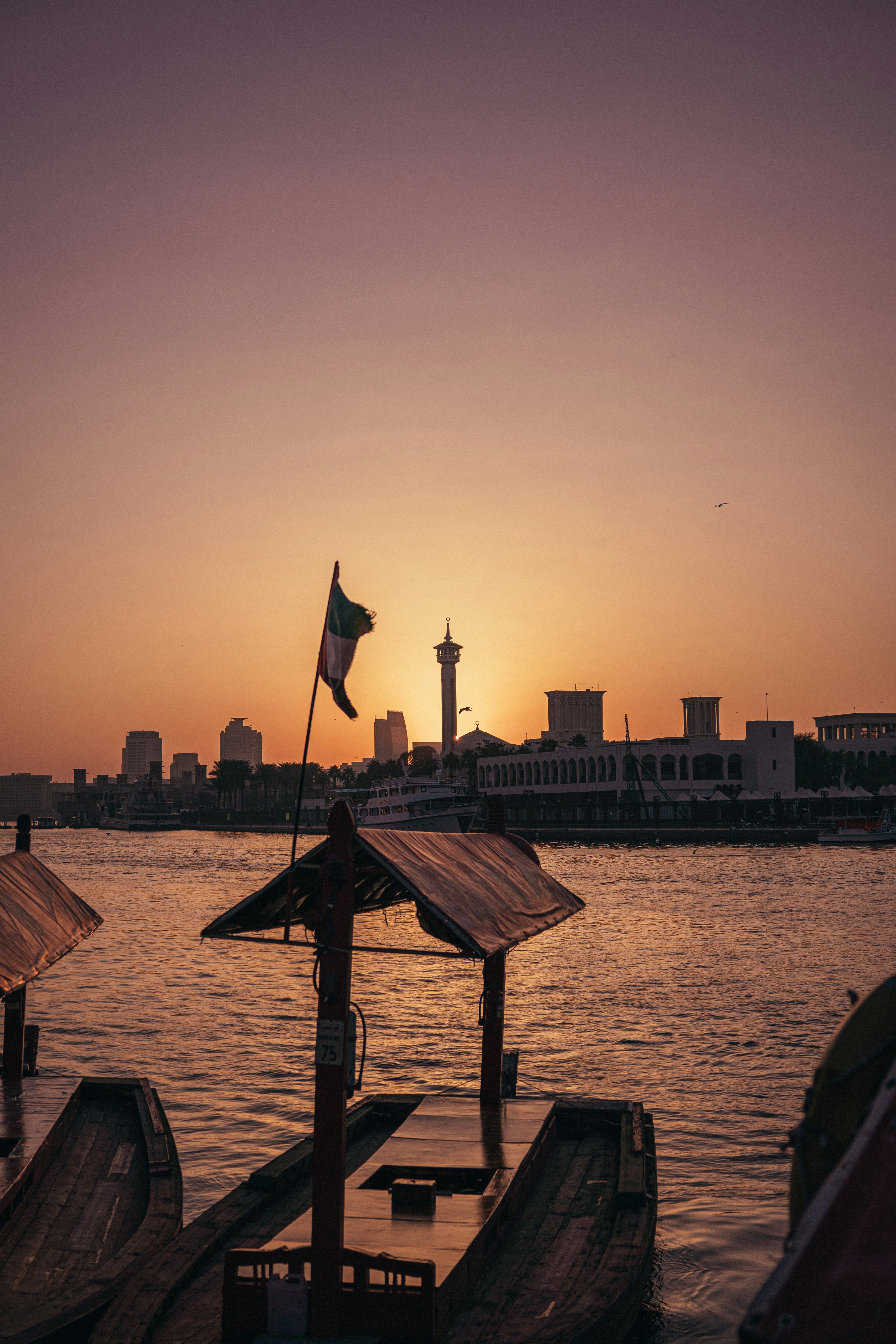 the sun is setting over a body of water