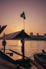 the sun is setting over a body of water