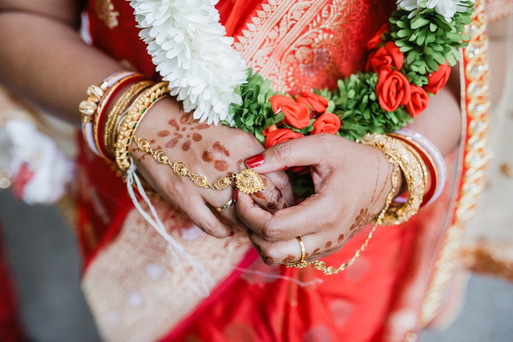 a close up of a person holding a henna