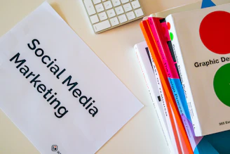 a sign that says social media marketing next to a keyboard