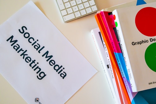 a sign that says social media marketing next to a keyboard