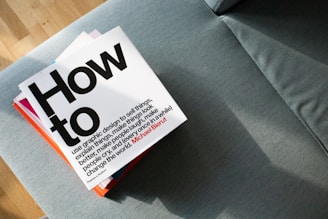 a close up of a book on a couch