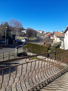 A welcoming Artesia neighborhood street with well-maintained homes under a bright blue sky.