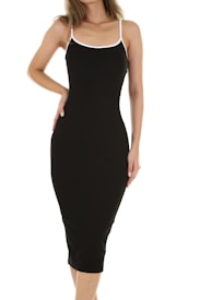 A woman is wearing a form-fitting, black sleeveless dress with white straps. The dress is knee-length and the background is plain white.