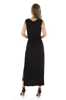 A stylish woman wearing a sleek black dresply dress standing against a minimalist white background
