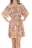 A person is wearing an off-shoulder dress with a floral pattern in warm tones of pink, peach, orange, and yellow. The dress features ruffled layers and a waist tie, and the person has their hands on their hips.