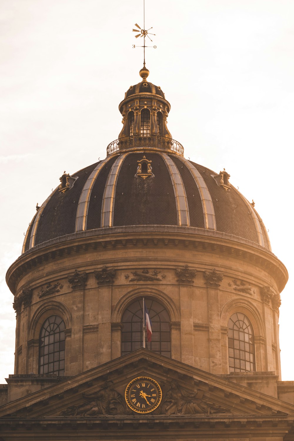 a large dome with a clock on the top of it