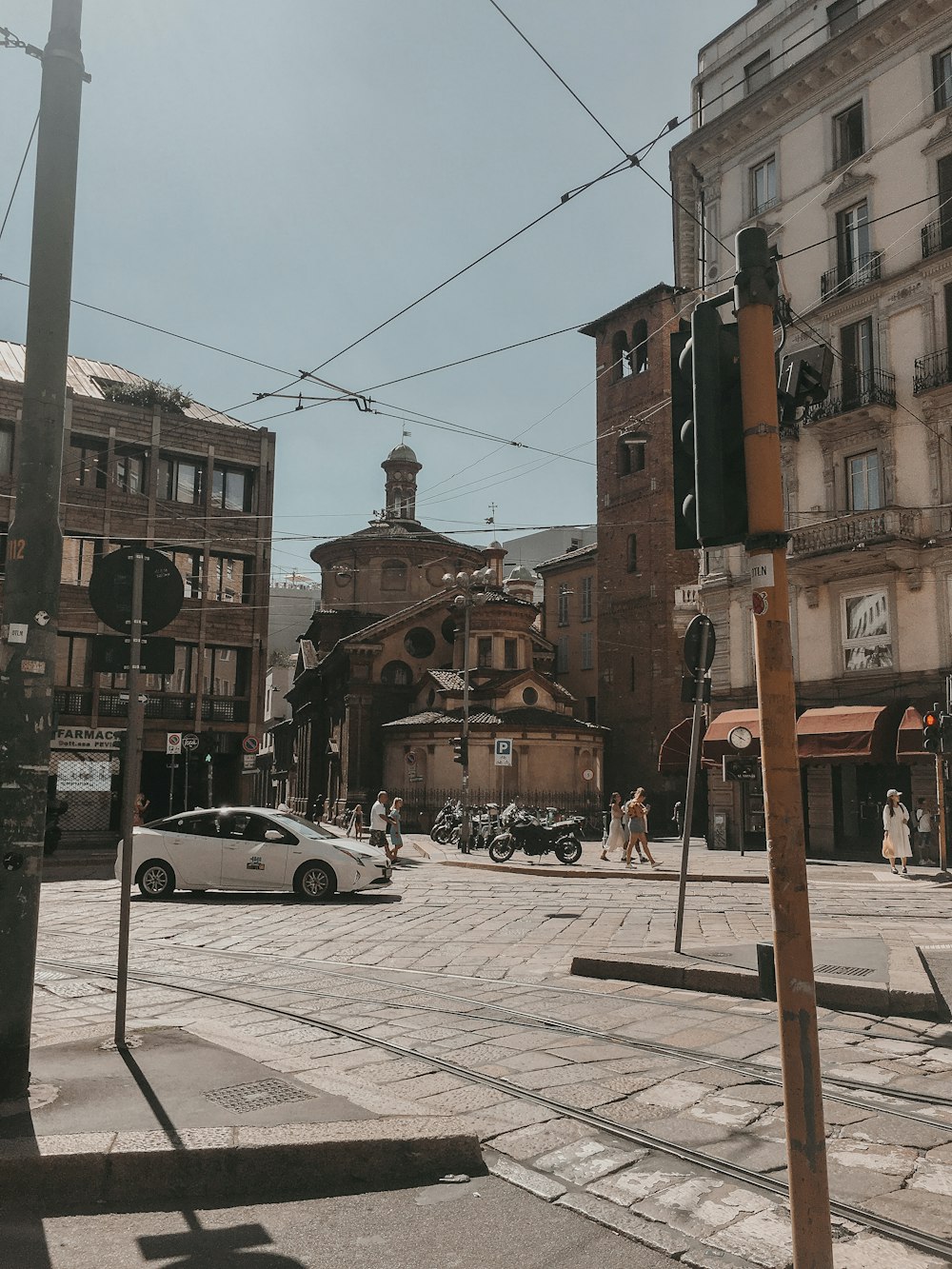 a city street with cars parked on the side of it