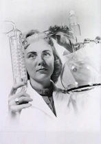 a black and white photo of a woman holding a flask