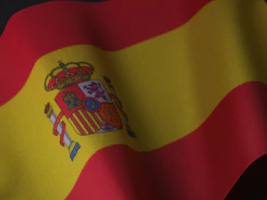 the flag of spain is waving in the wind