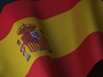 the flag of spain is waving in the wind