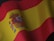 the flag of spain is waving in the wind