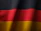 the flag of germany is waving in the wind