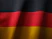 the flag of germany is waving in the wind
