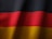 the flag of germany is waving in the wind