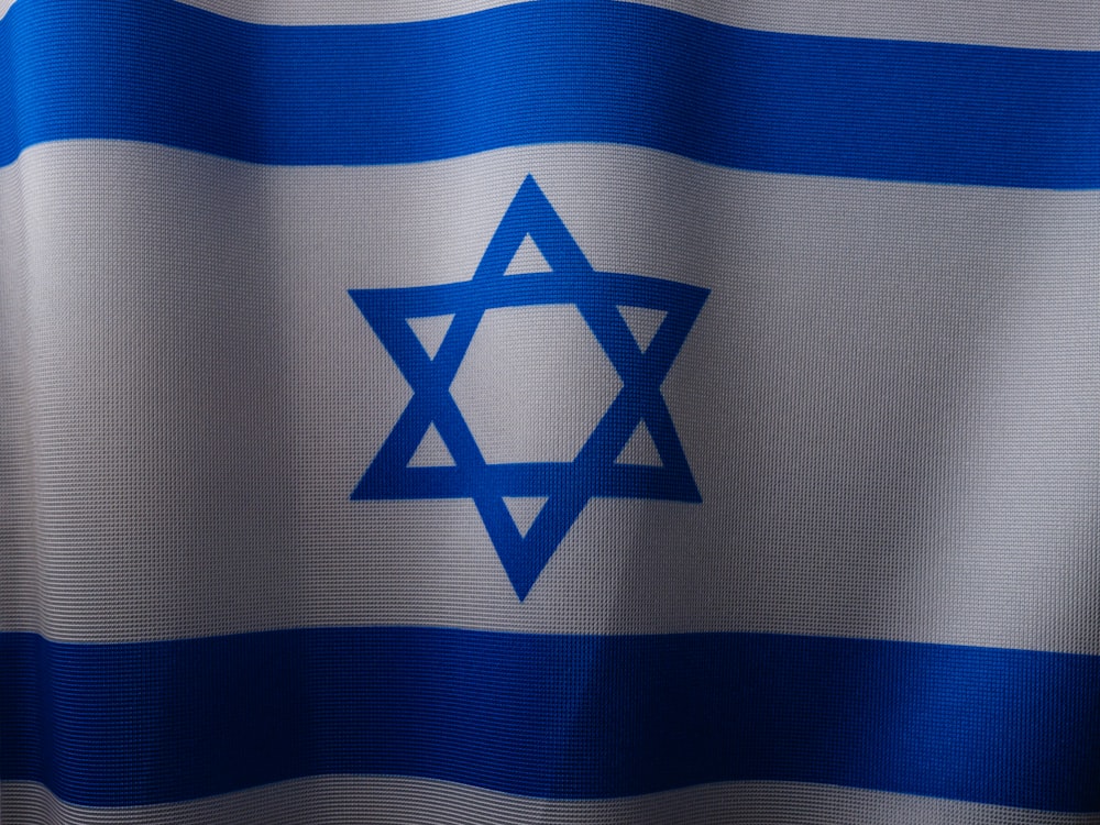 a close up of a flag with a star of david on it