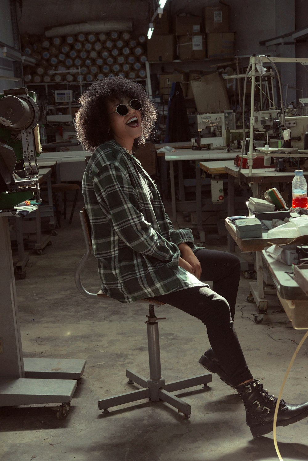 a woman sitting on top of a chair in a room