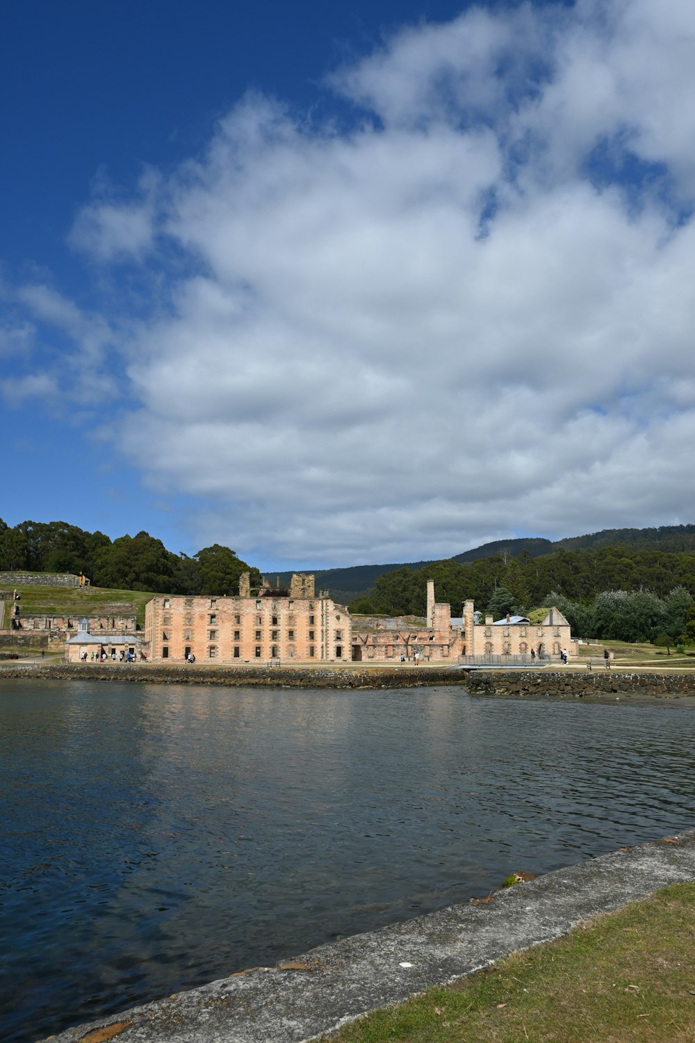 a large building sitting next to a body of water