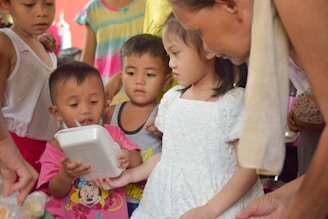 A group therapy session with children using AAC.
