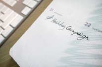 Close-up of hands working on a digital marketing strategy on a tablet.