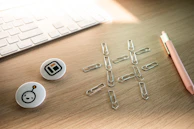An asymmetrical grid of design elements laid out on a cream-toned desk.