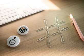 An asymmetrical grid of design elements laid out on a cream-toned desk.