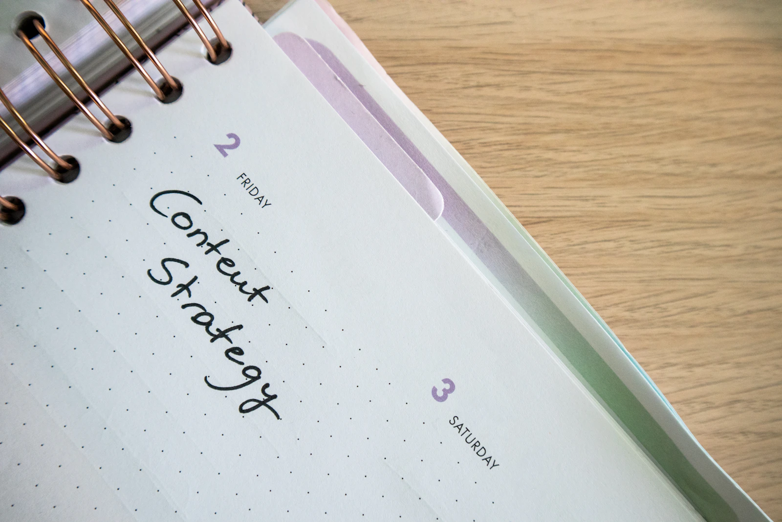 Open planner and pen on a desk, representing calendars, written reminders, and external systems for ADHD-related forgetfulness