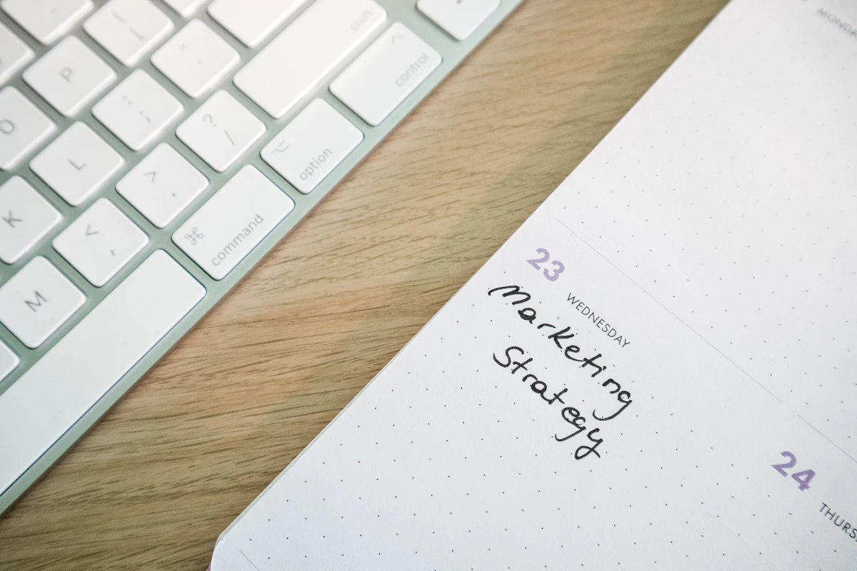 Planner and keyboard representing smart roster planning