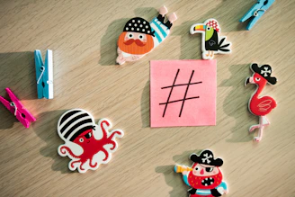 A colorful chore chart displayed on a family bulletin board with magnets.