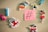 A collection of colorful cartoon-themed magnets and clothespins arranged on a wooden surface around a sticky note with a large hashtag symbol. The magnets include pirate-themed animals and characters like an octopus and birds wearing pirate hats.
