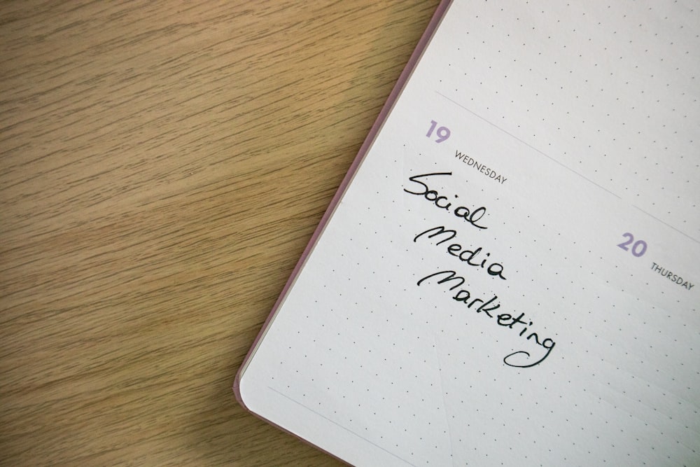 a notepad with the words social media marketing written on it