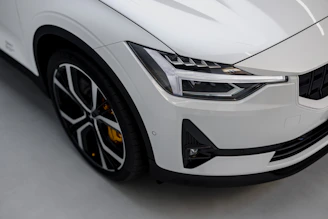 Side view of a car with a spotless, waxed surface under natural light