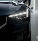 a black car is parked in a garage