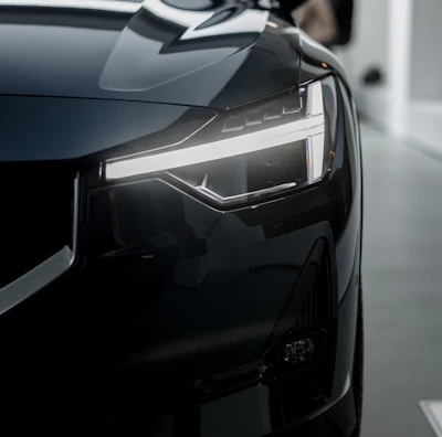a black car is parked in a garage