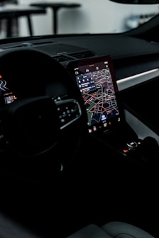 the dashboard of a car with a gps device