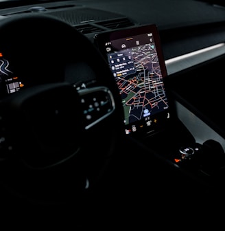 the dashboard of a car with a gps device