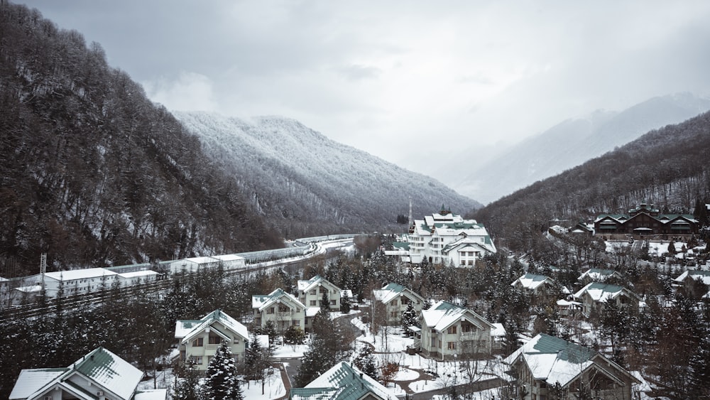 a village in the mountains covered in snow