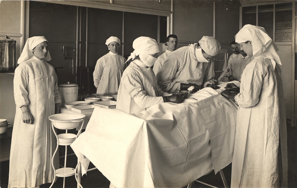 a black and white photo of a group of doctors