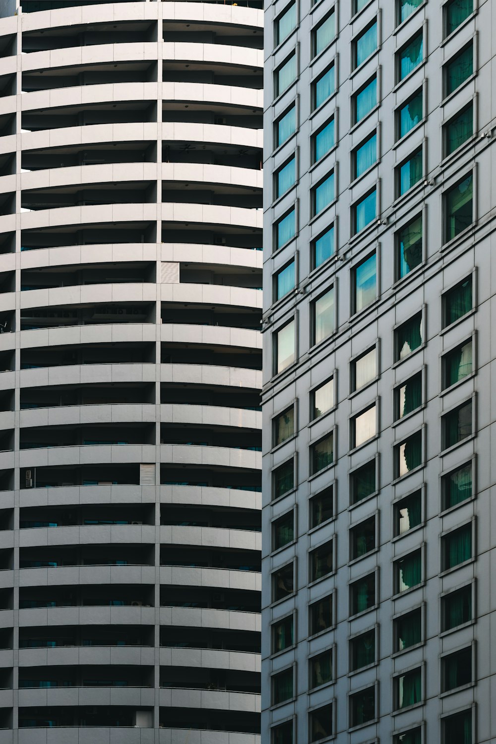 a tall building next to a smaller building