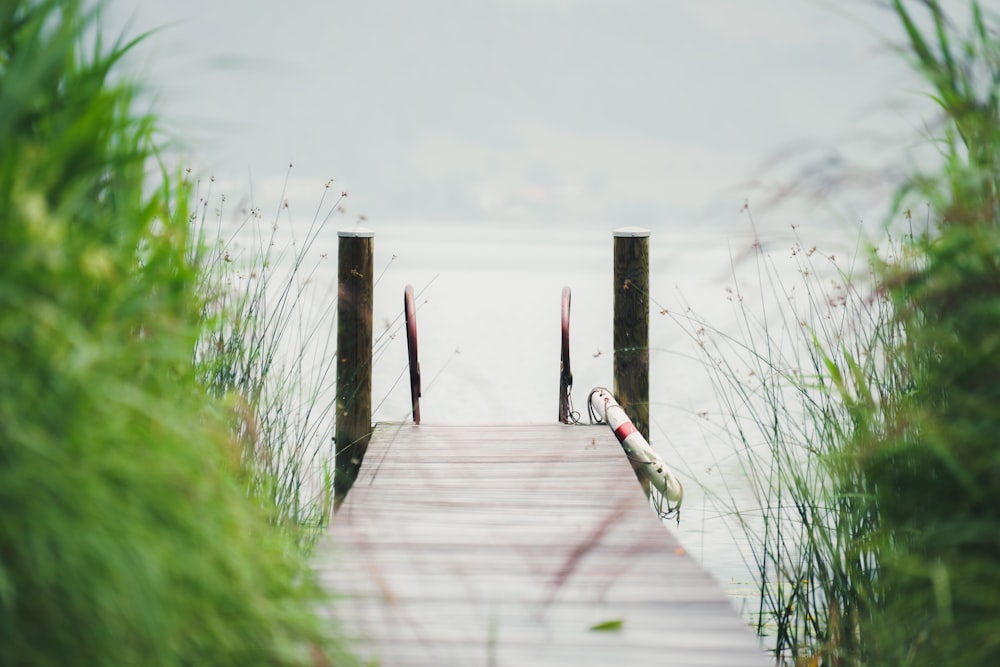 a wooden dock with a pair of skis on it