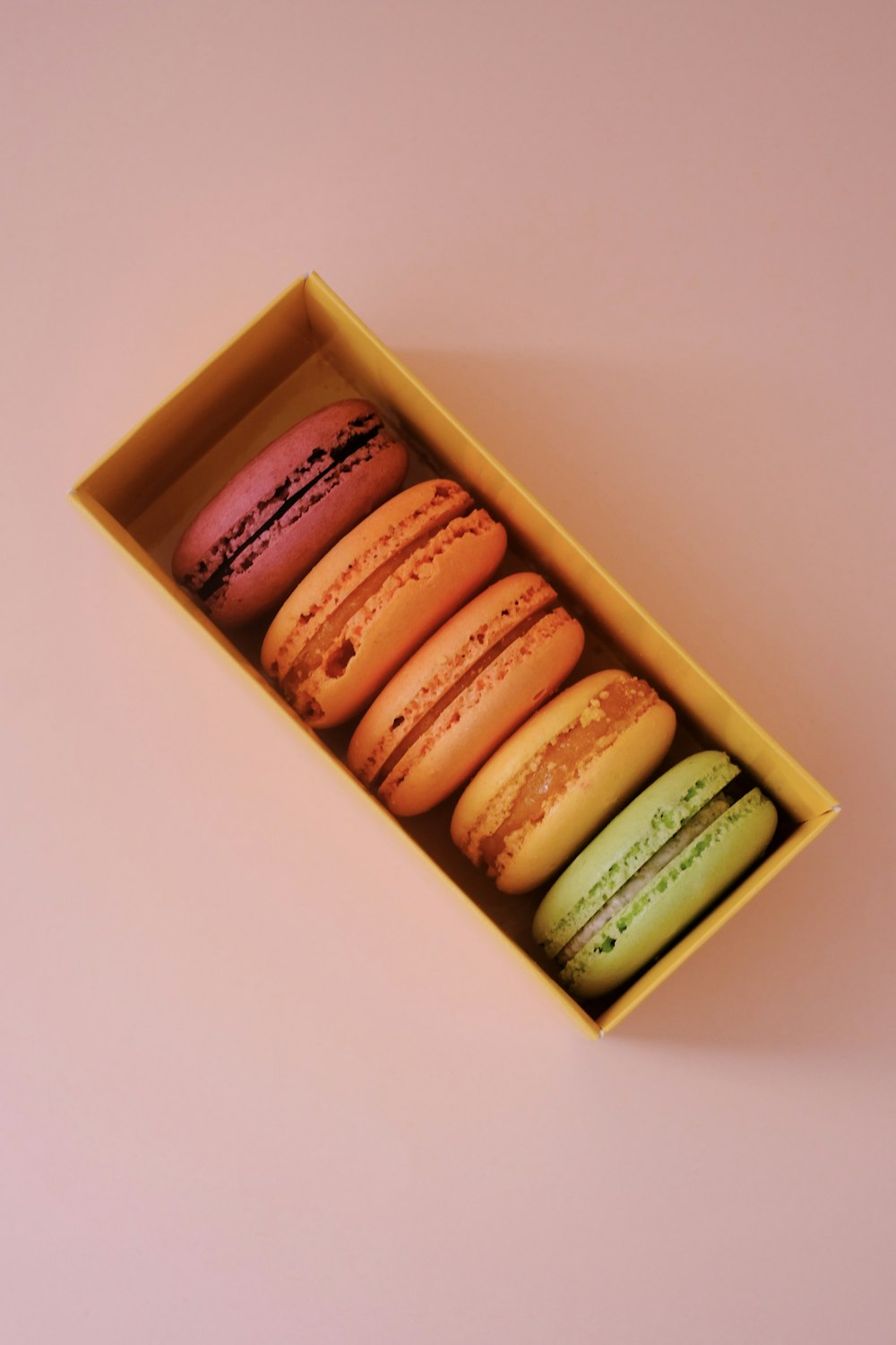 a box of macaroons sitting on a table