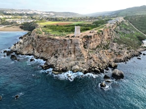 an aerial view of a small island in the middle of the ocean