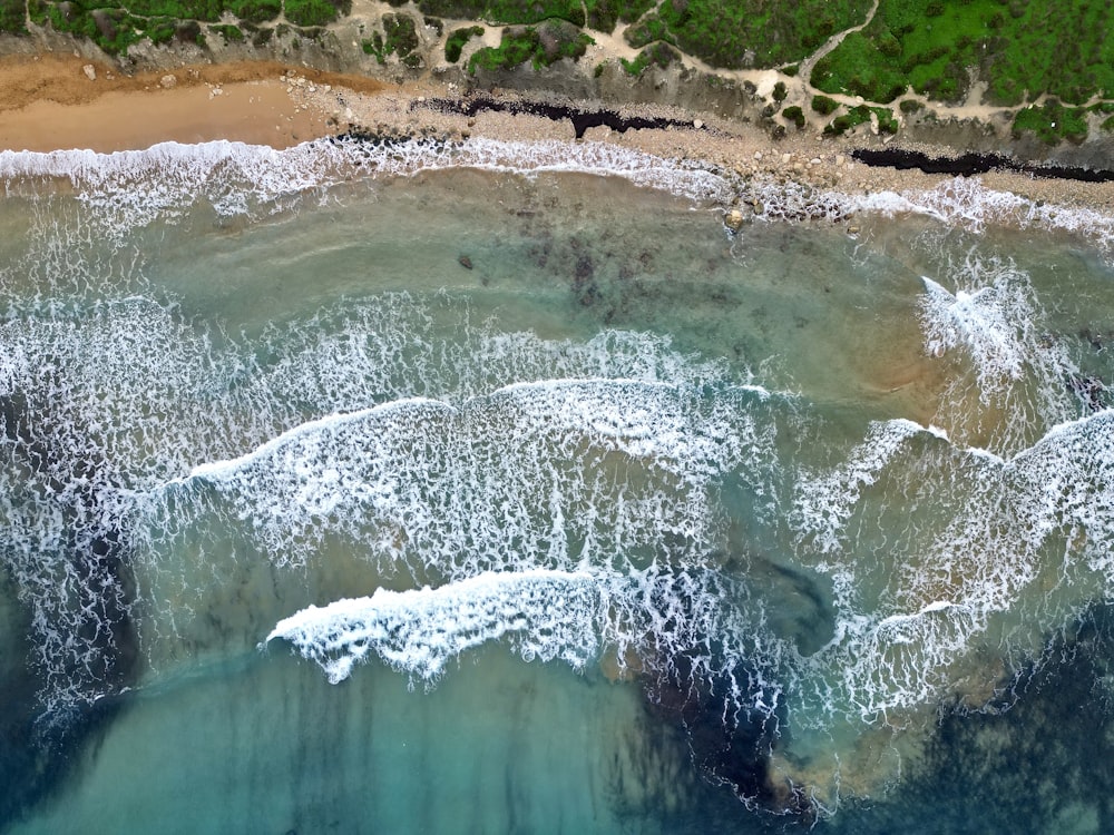 an aerial view of a beach and ocean