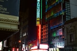 Detail of a colorful LED letter sign mounted on a modern building facade.