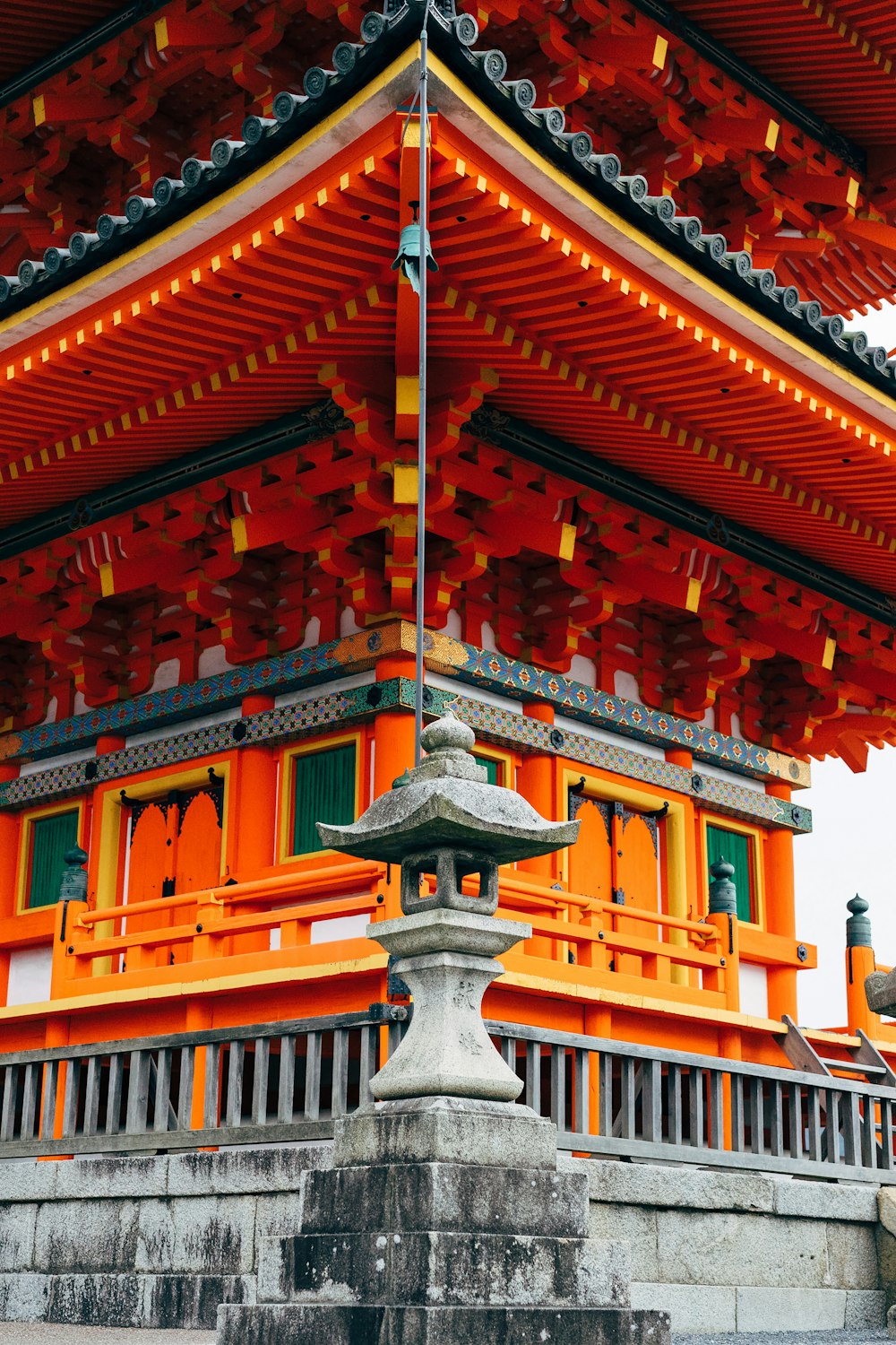 a tall orange building with a bell tower