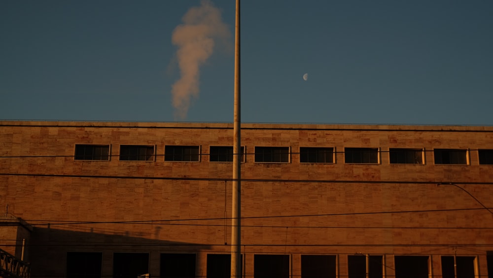 a building with a flag pole in front of it